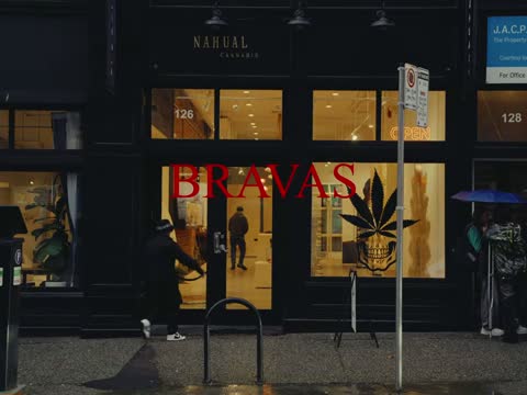 RAW 001, frame 01: a shopfront on the street with the red BRAVAS title